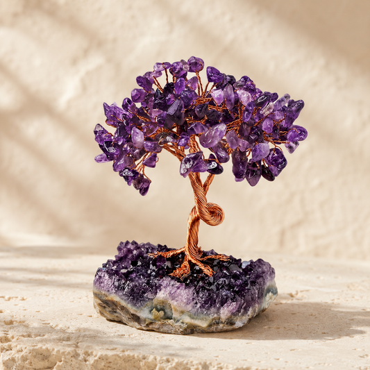 Natural amethyst crystal tree on warm ivory limestone